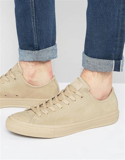 lookastic beige sneakers.